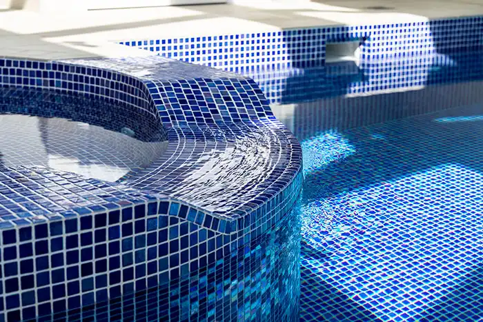 Close up on the tiling of the spa area of the pool