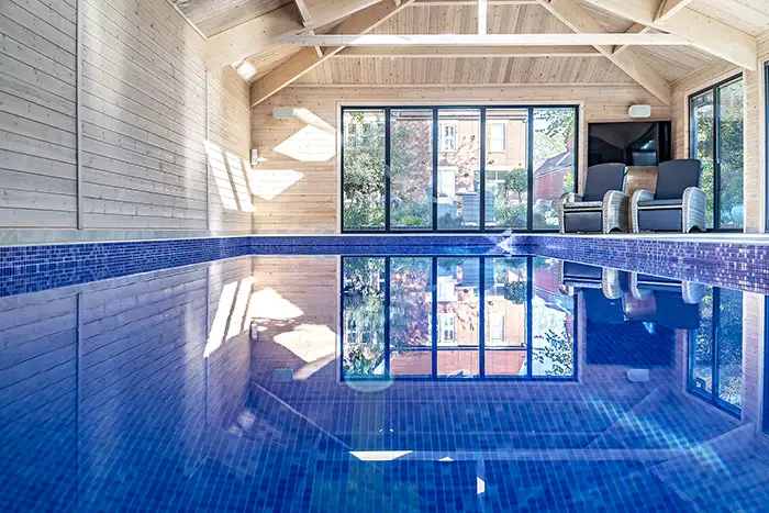 Moving floor pool looking across an indoor pool