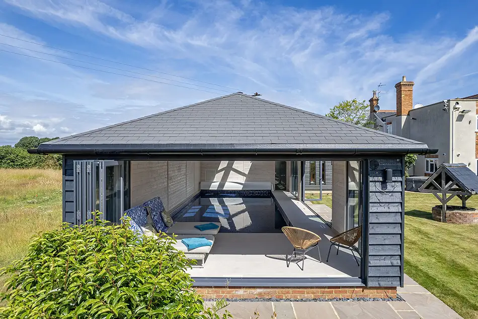 Indoor pool with bifold doors open