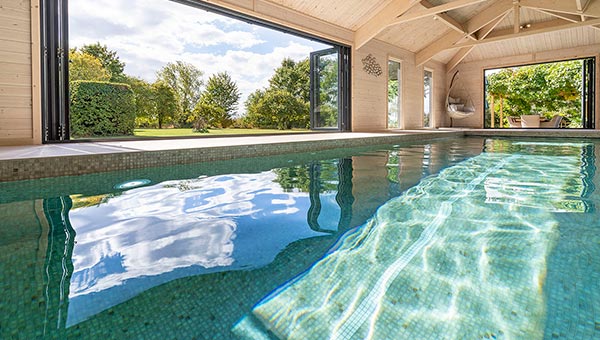 indoor pool, with doors open and reflections from the water surface